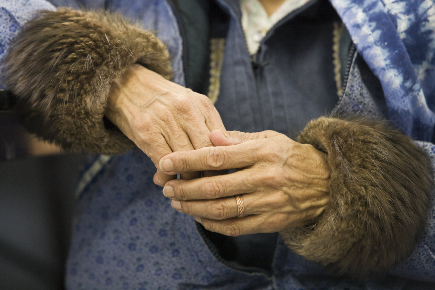 NANA woman holds hands