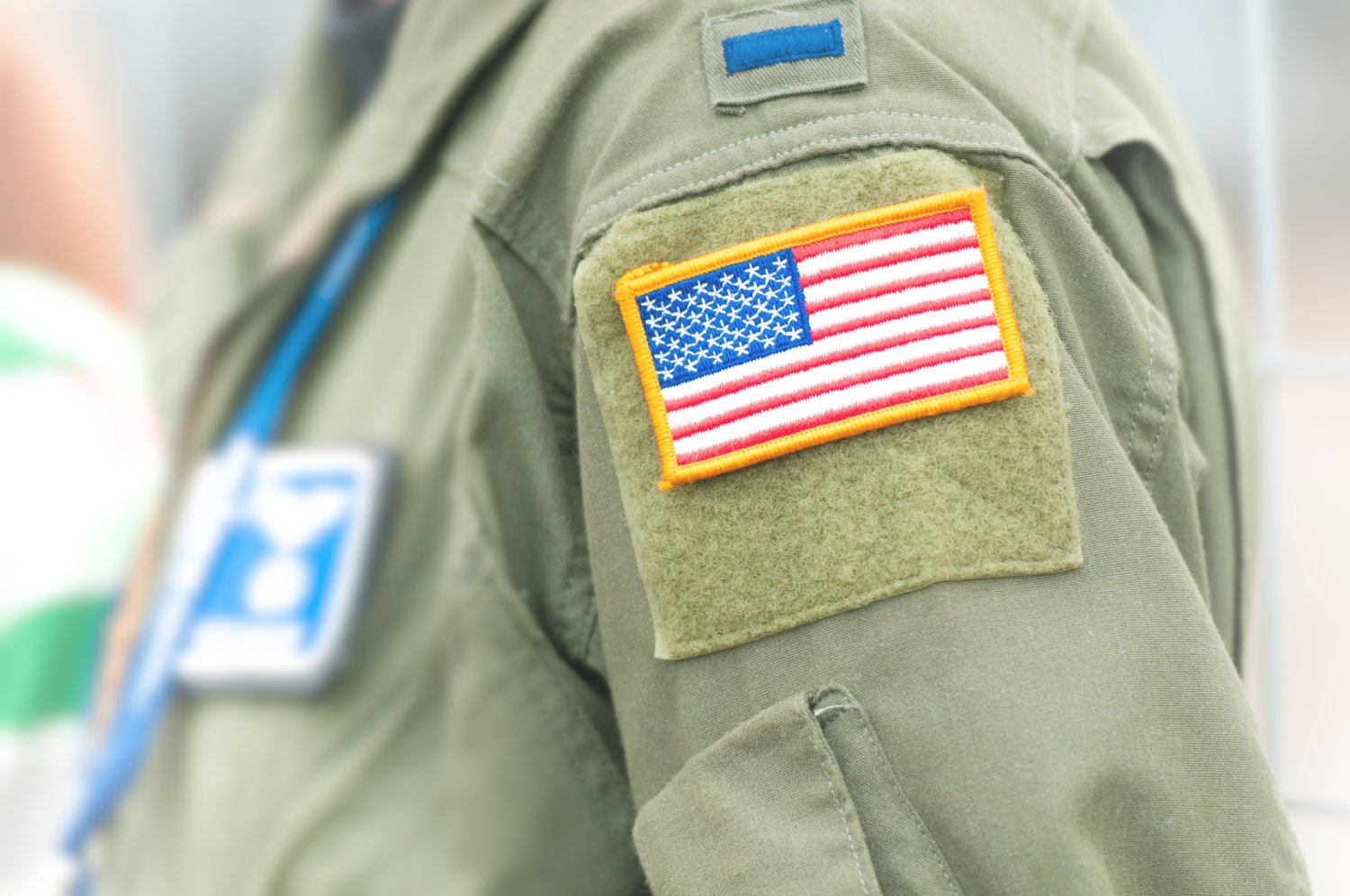 American flag on USAF uniform of person.