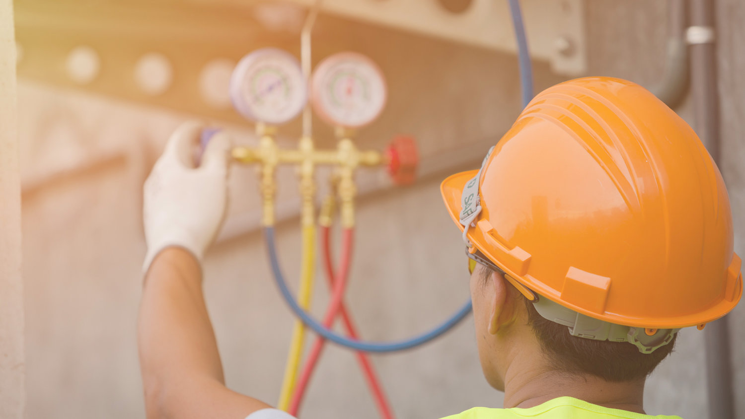 Man fixing mechanical HVAC equipment