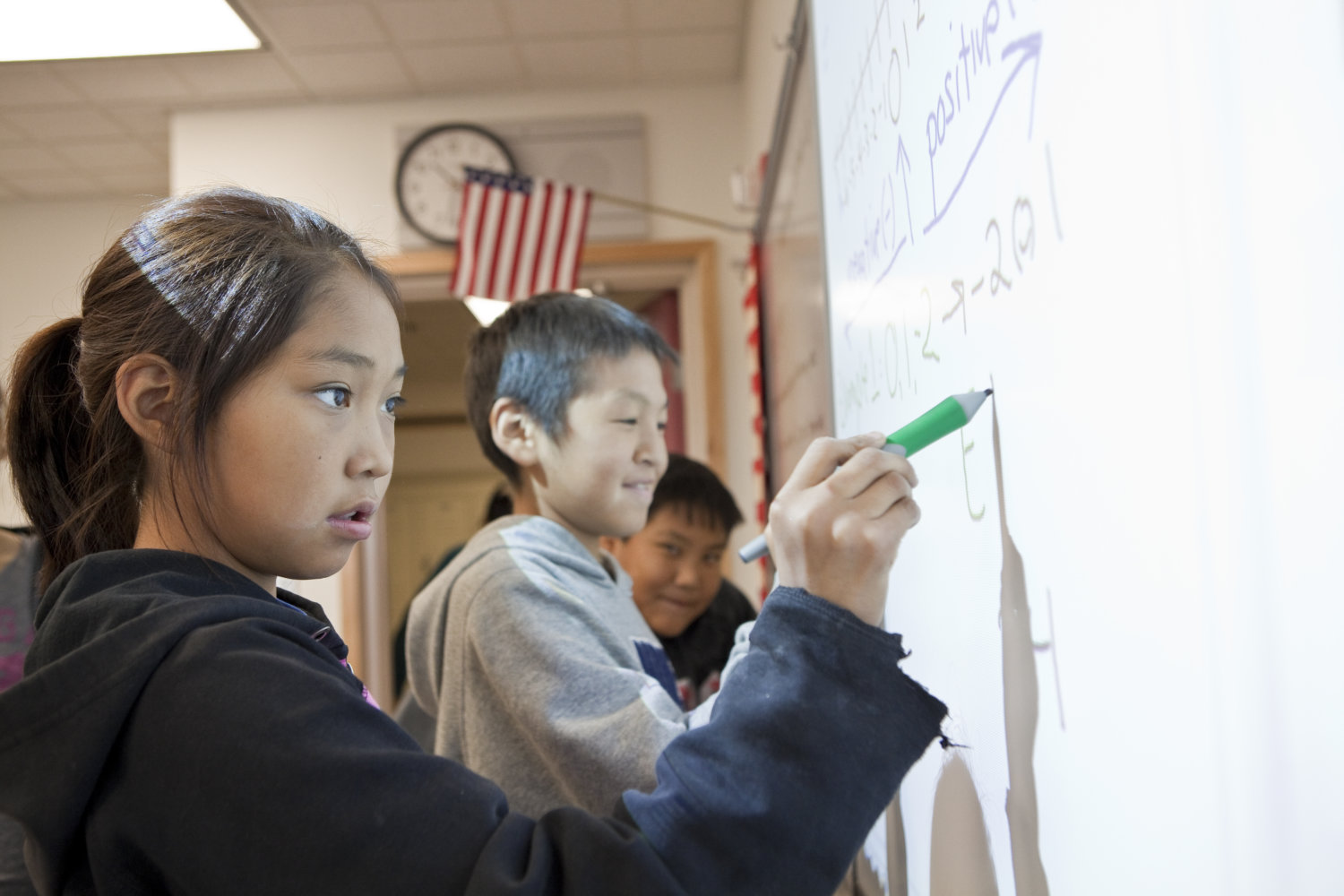 NANA students drawing on white board