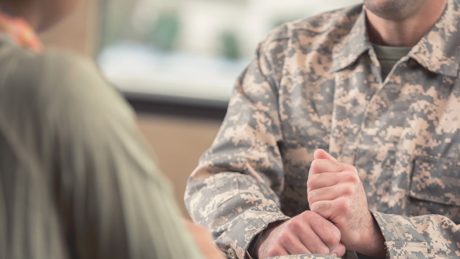 Solider sitting at a desk