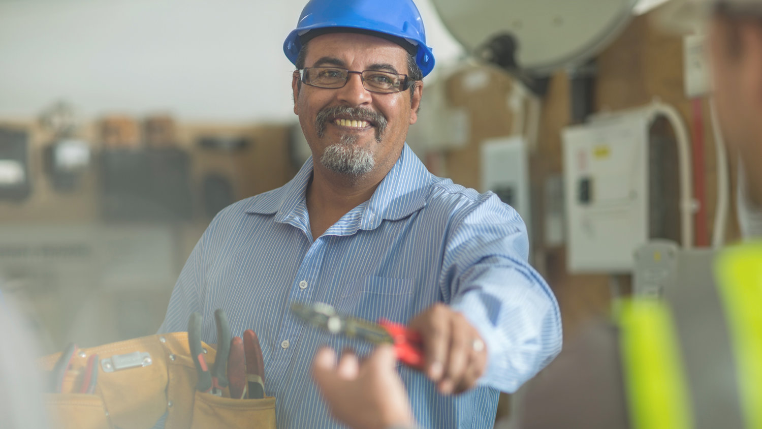 Man holding out repair equipment