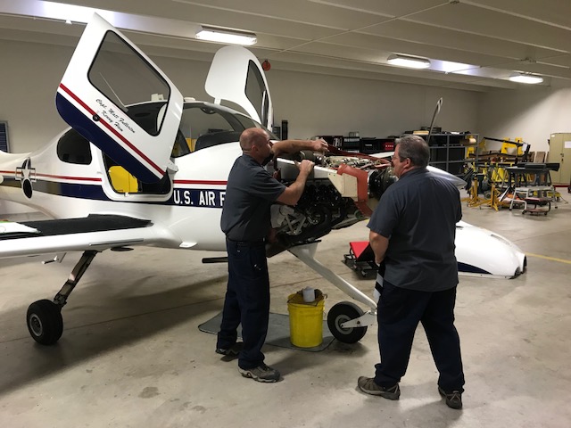 Men working on Air Force plane