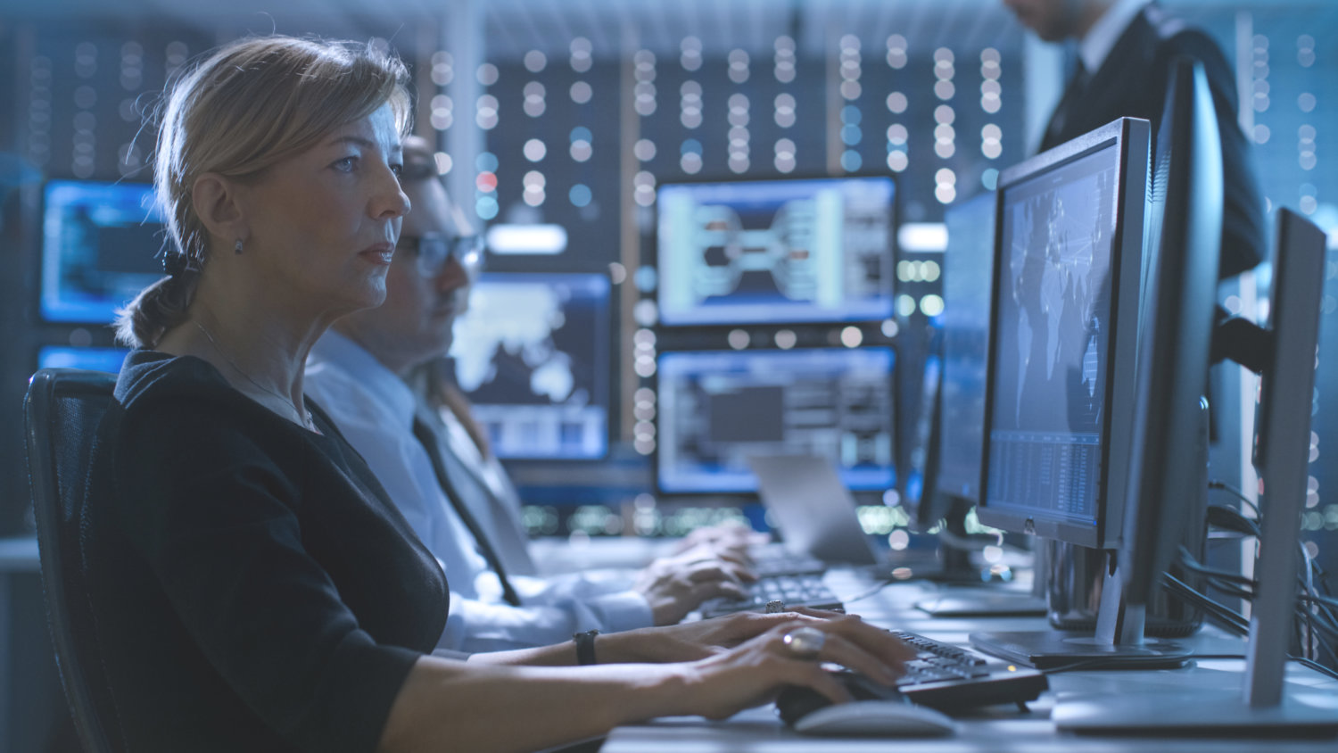 Female Government Employee Works in a Monitoring Room