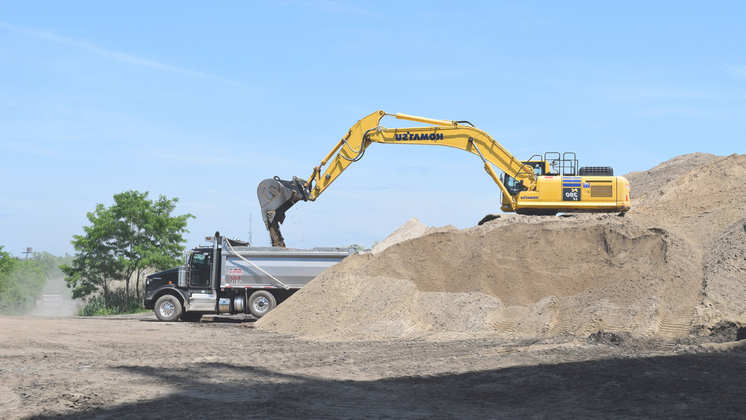 Excavator removing sand