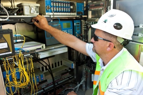 Man performing work on electrical equipment