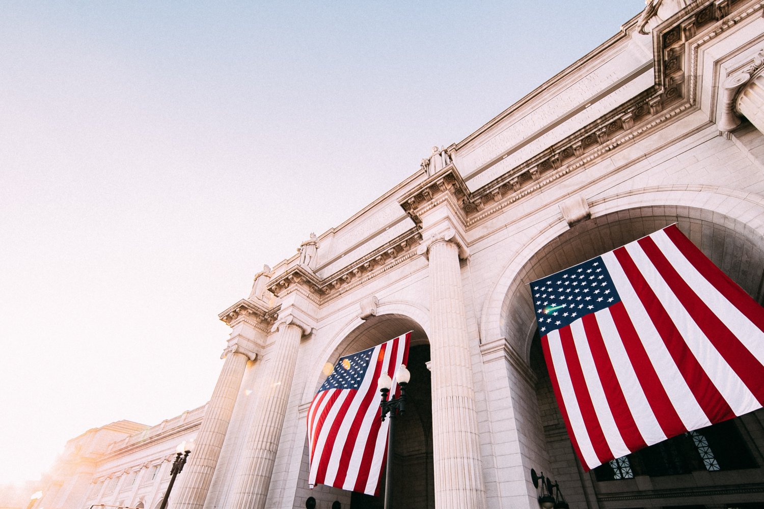 American flags hanging on building