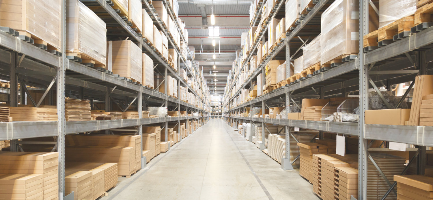 Rows Of Shelves With Boxes In Warehouse