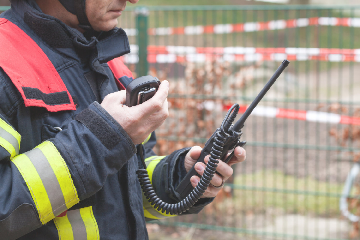 Firefighter in action with walkie talkie