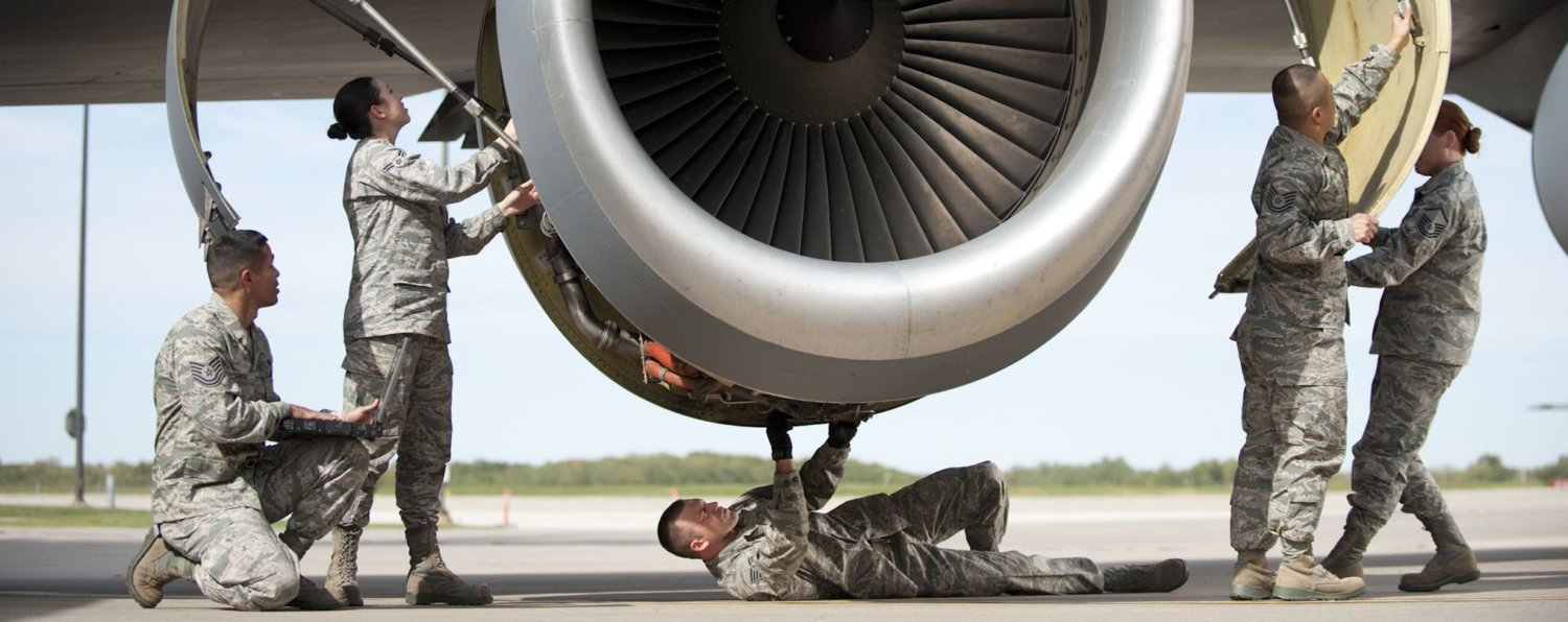 Air Force personnel providing maintenance on aircraft