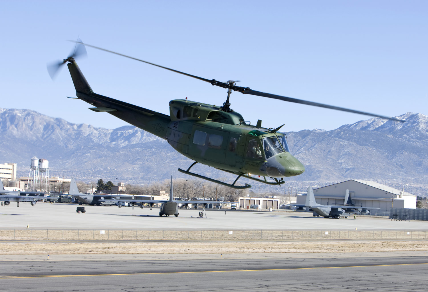 A UH-1N flies near Kirtland AFB